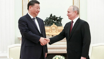 Xi says invited Putin to visit China this year