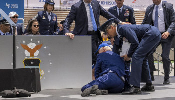 Biden falls on stage at US air force academy graduation